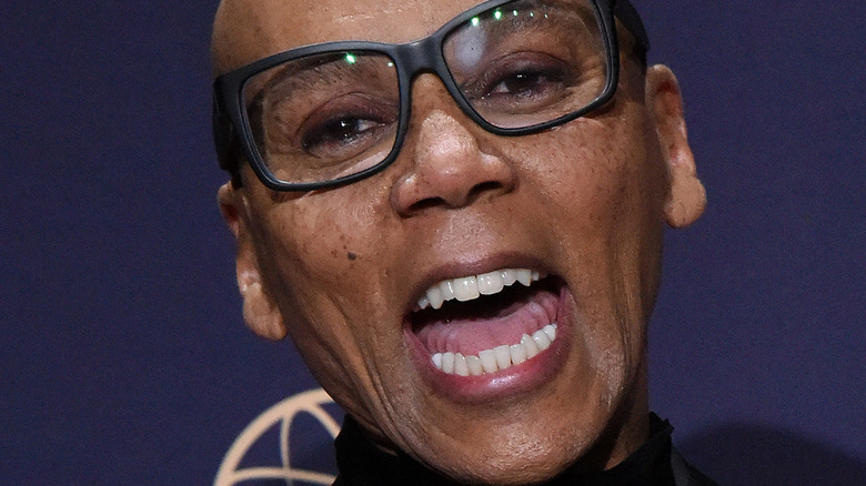 RuPaul smiling and laughing