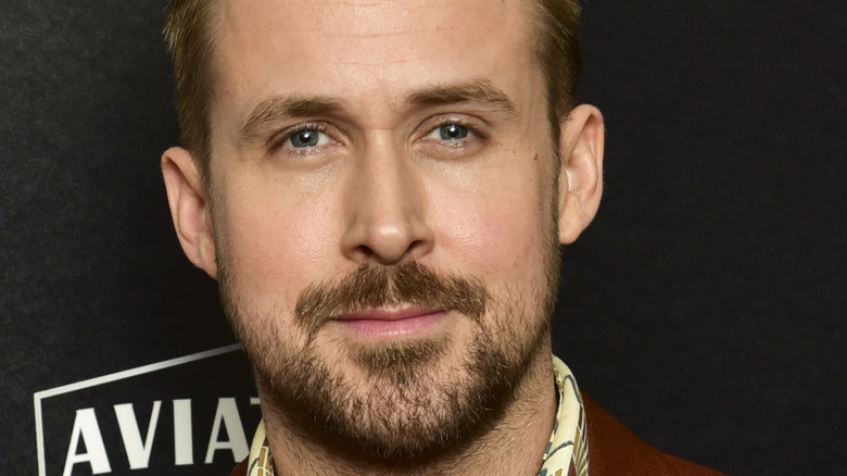 Ryan Gosling looking serious with facial hair