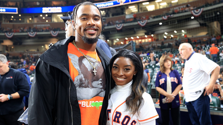 Simone Biles and Jonathan Owens posing for pics