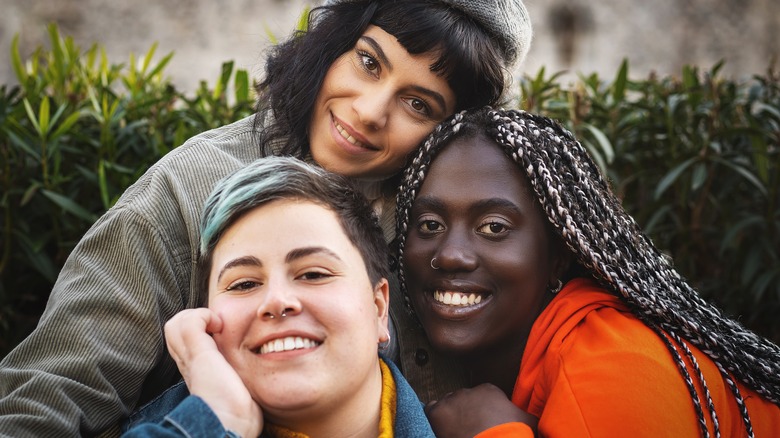 A group of smiling Gen Z BIPOC friends 