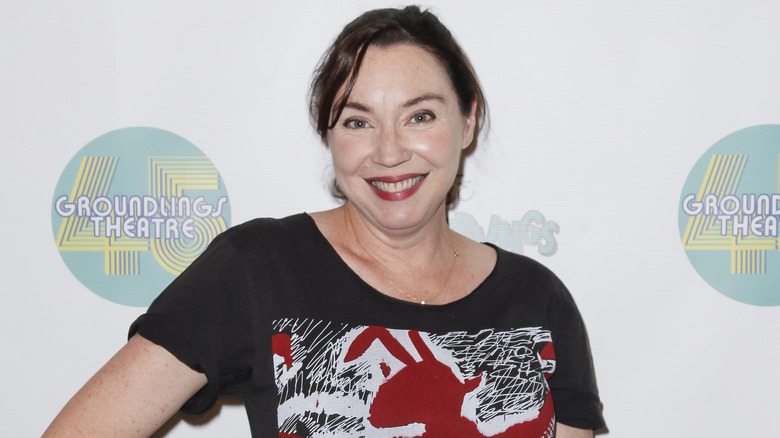 Stephanie Courtney poses for Groundlings Theatre wearing a black graphic t-shirt.