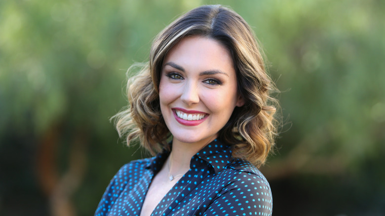 Taylor Cole posing outside of Hallmark's Home & Family at Universal Studios