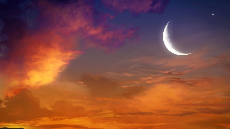 New moon crescent during sunset 