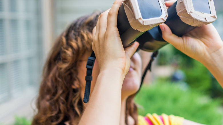 A woman with special binoculars