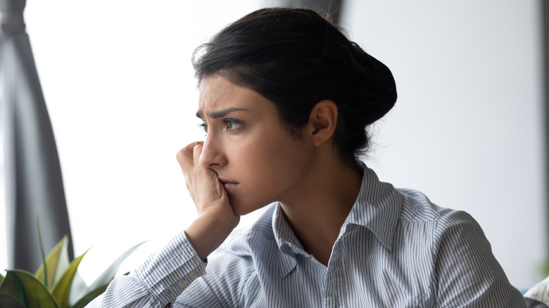 A woman looking worried. 
