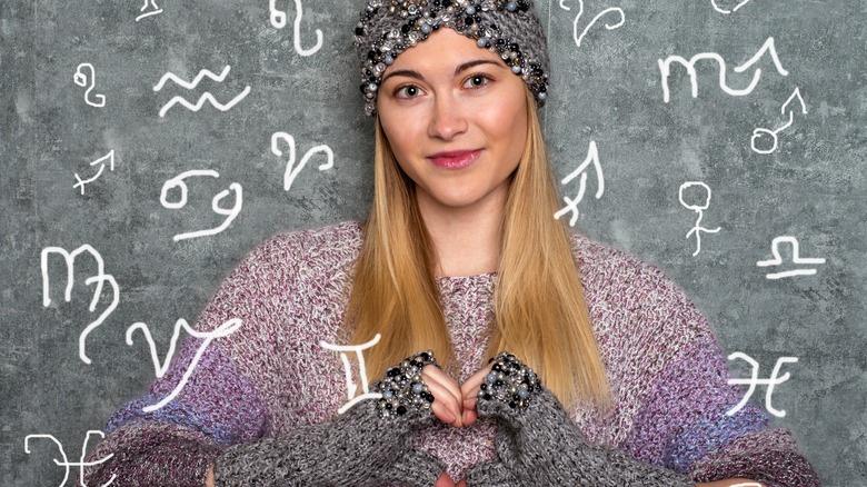 A woman surrounded by zodiac signs. 