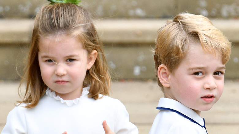 Princess Charlotte and Prince George looking serious