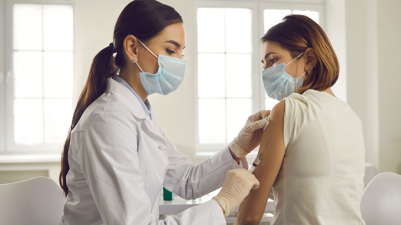 Woman receiving vaccine