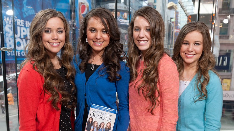 Jessa, Jinger, Jill and Jana Duggar hold book