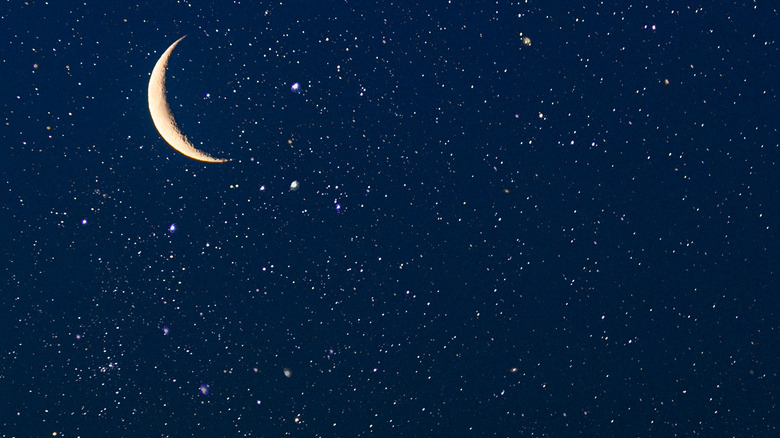 A crescent moon in starry night