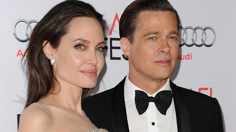 Angelina Jolie and Brad Pitt posing