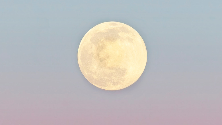 Large full moon in the clear, ombre sky