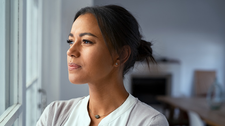 A woman looking off into the distance. 