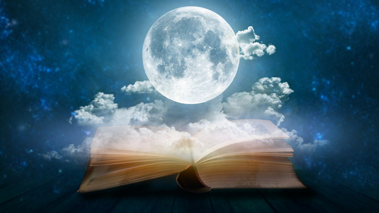A full moon over an open book