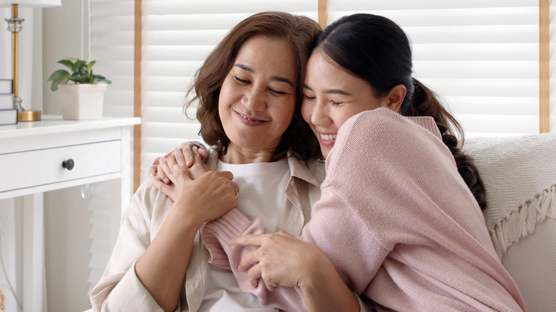 Woman hugging her mother 