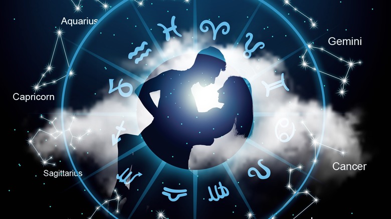 A couple and a zodiac circle. 