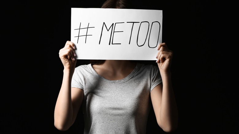 woman holding "me too" sign