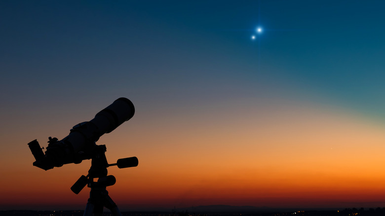 Telescope overlooking lunar eclipse 