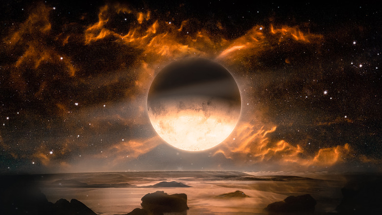 Moon surrounded by fiery sky