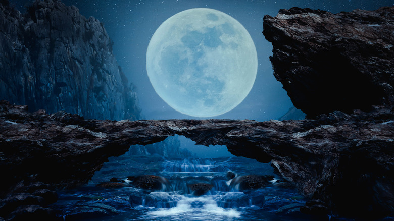 Full moon over a waterfall. 