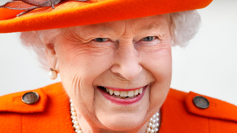 Queen Elizabeth in orange hat