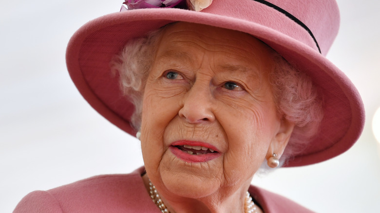 The late Queen Elizabeth II looking regal in pink