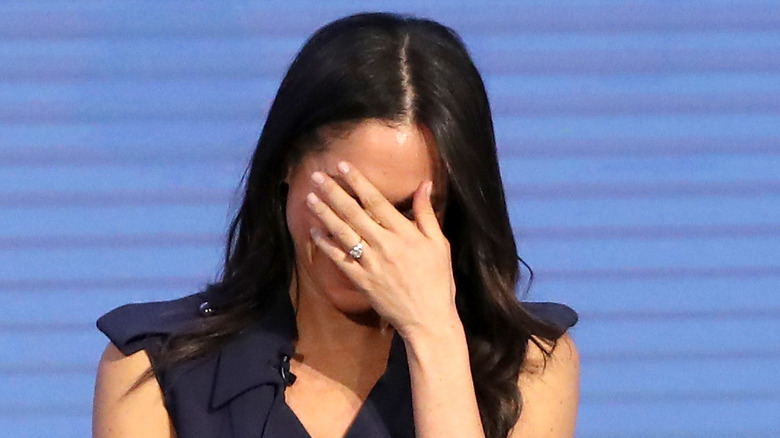 Meghan Markle hiding face