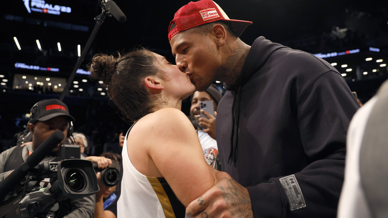 Kelsey Plum kissing Darren Waller