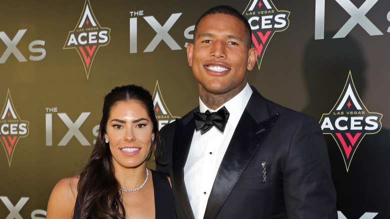 Kelsey Plum and husband Darren Waller posing