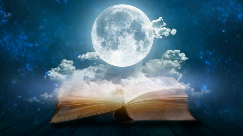 Full moon above an open book
