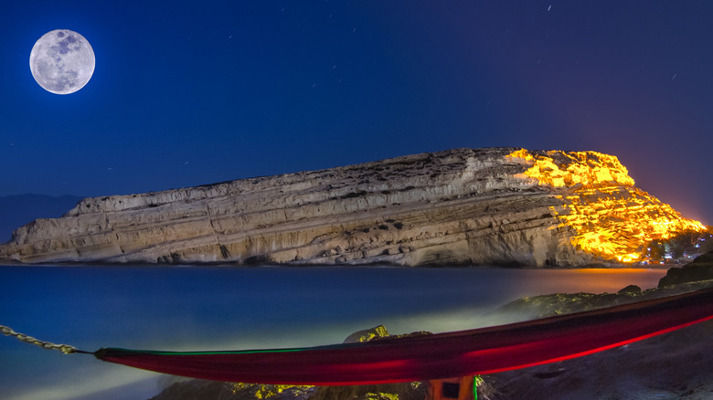 A full moon over water. 