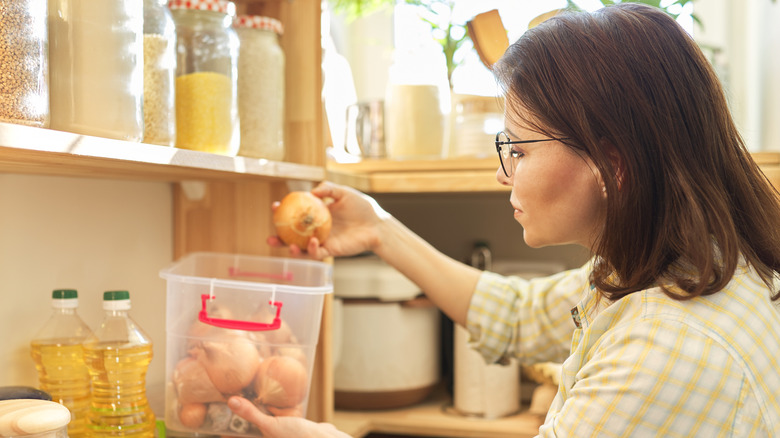 Woman organizing her pantry