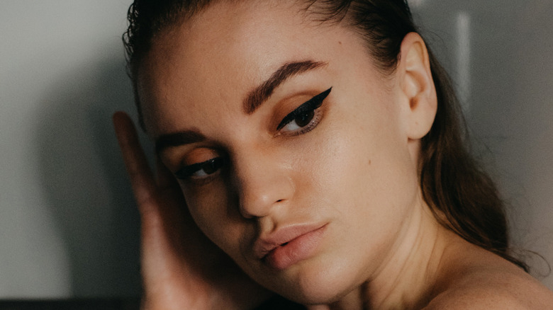 model posing with dramatic eyeliner