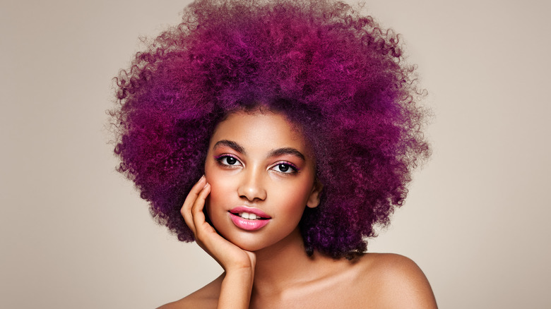 Young woman with purple kinky hair