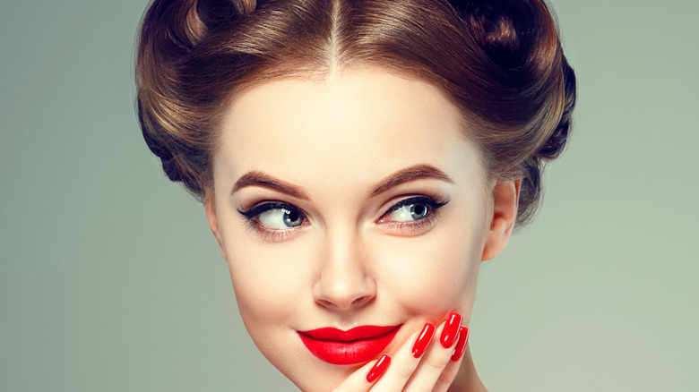 Woman smiling in vintage makeup 