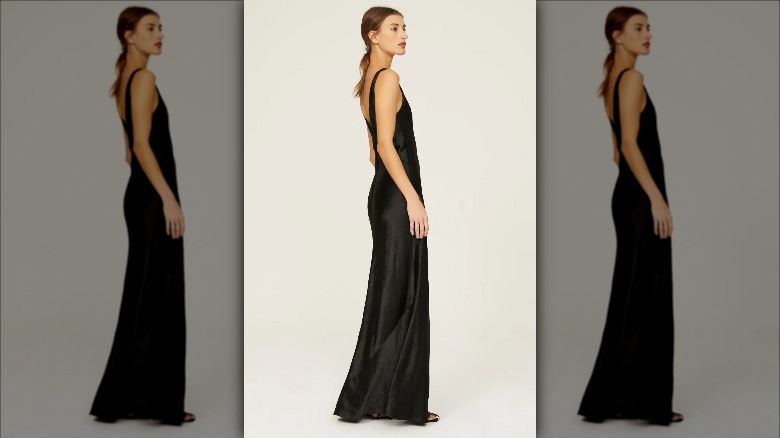 model wears Vince satin gown white background