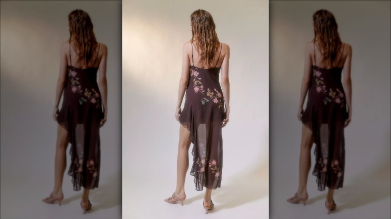 UO model wears asymmetrical brown floral midi 