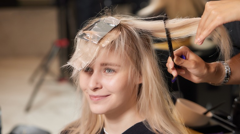 Woman getting hair done