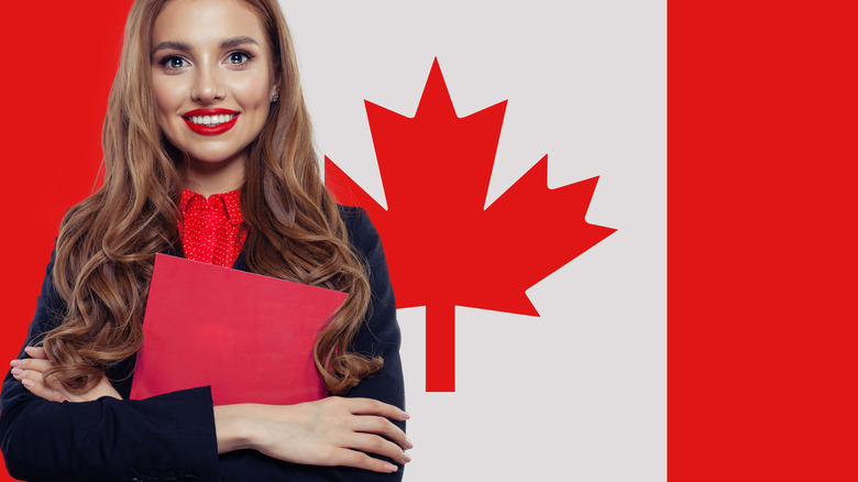 women in front of canadian flag