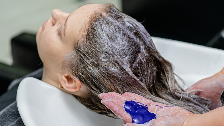 washing hair with purple shampoo