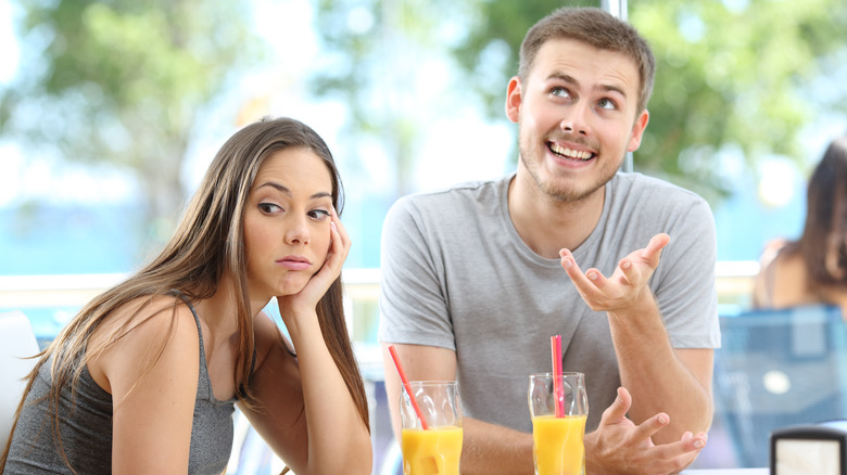 Woman looking bored on date