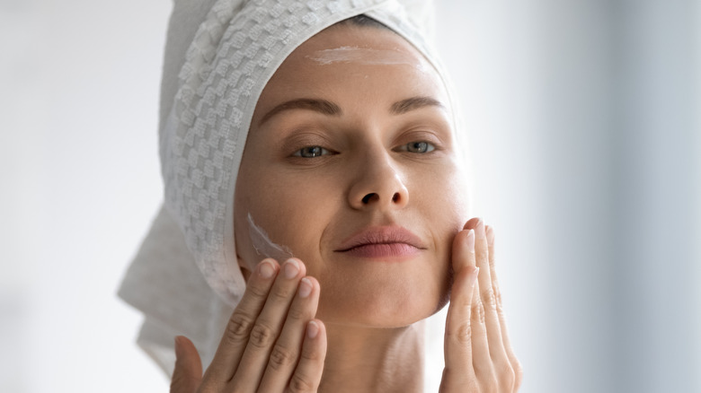 Woman with cream on her face