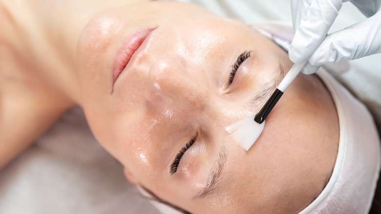 Woman receiving a chemical peel