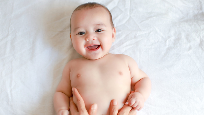 Smiling baby on white background