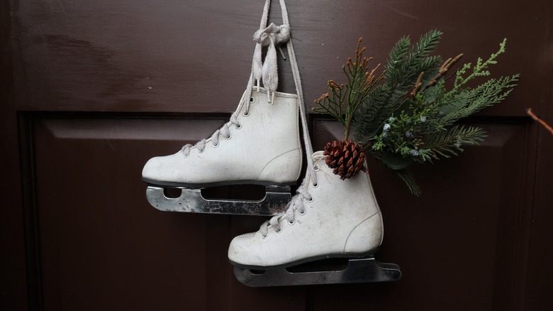 used figure skates on door