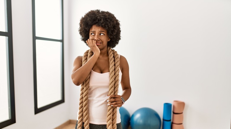 Woman looking nervous at gym