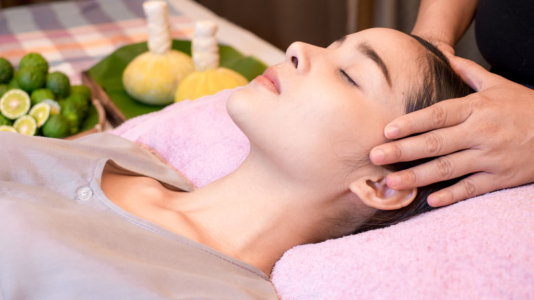 woman lying down head massage