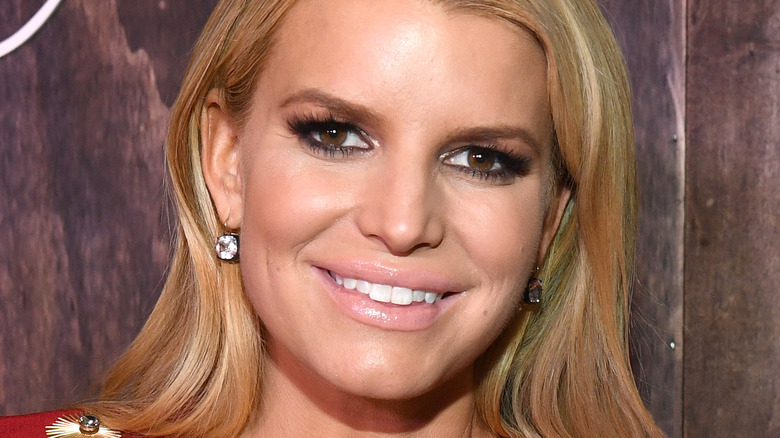 Jessica Simpson diamond earrings smiling