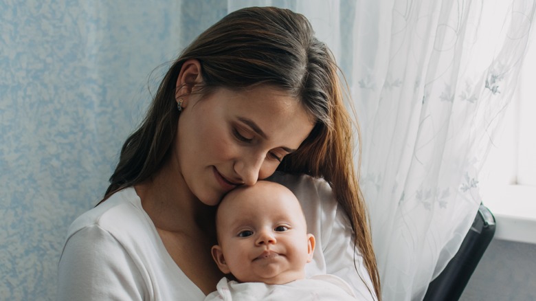 Mother holding her baby