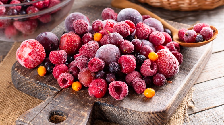 Frozen fruit on cutting board